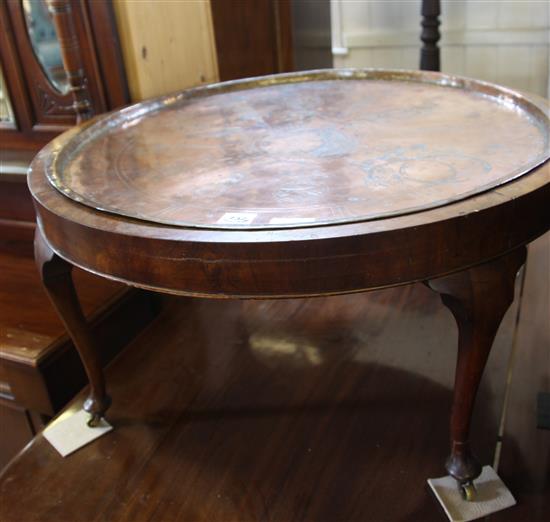 Walnut circular coffee table with copper tray top